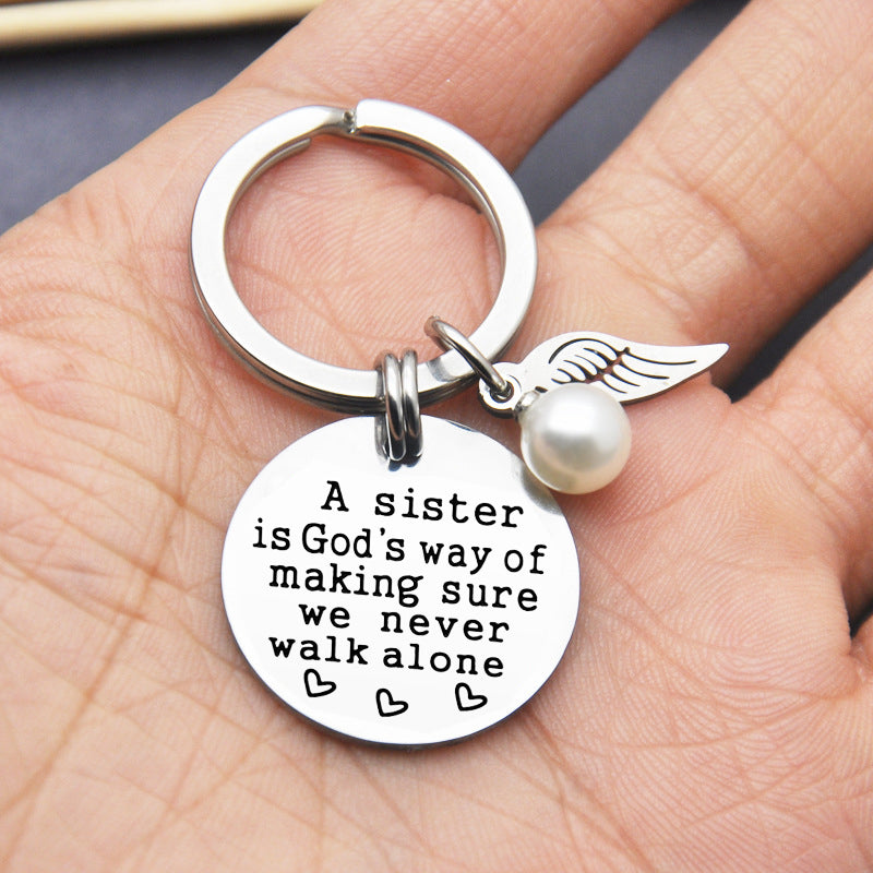 A Sister is God's Way of Making Sure We Never Walk Alone Keychain