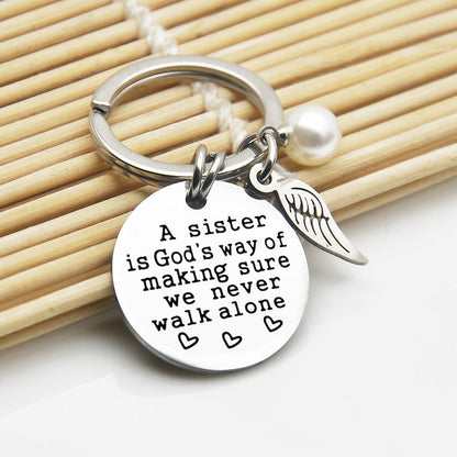 A Sister is God's Way of Making Sure We Never Walk Alone Keychain